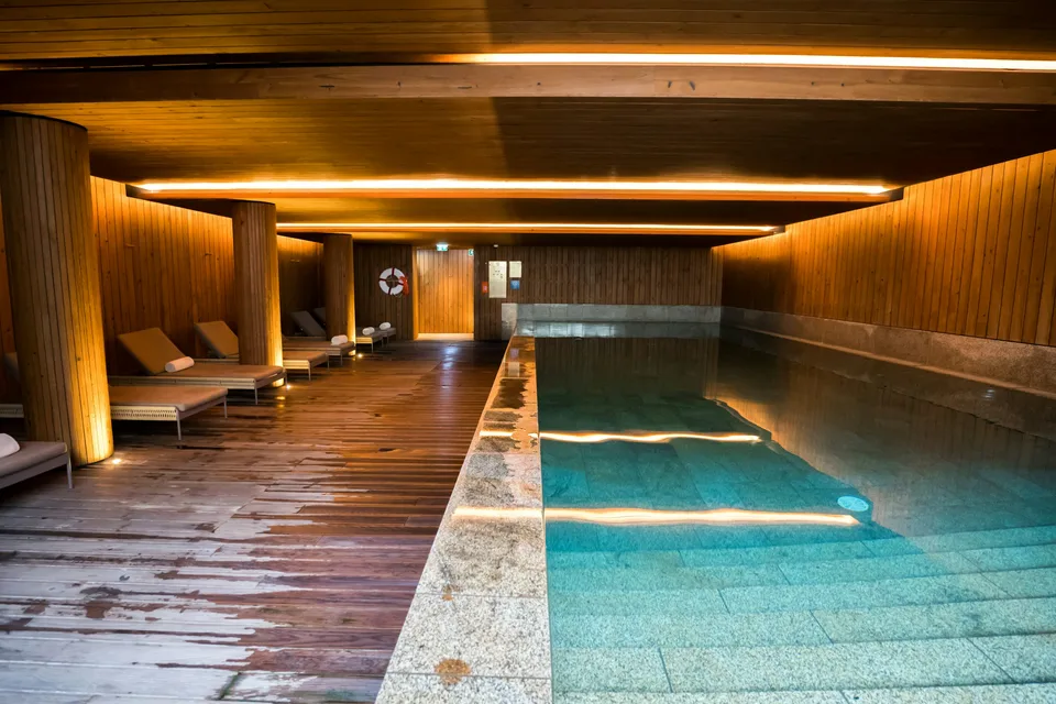 Indoor spa pool with warm wooden details