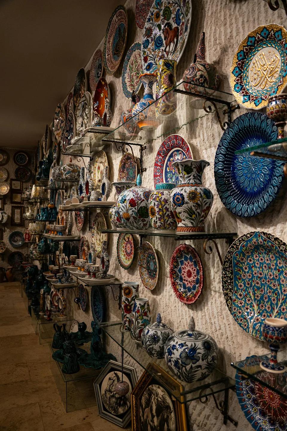 A ceramics shop with walls covered in hand-painted plates