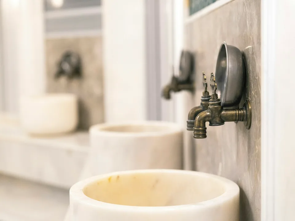 Marble basins and brass taps in a Turkish bath